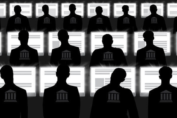 Faceless government employees monitoring computer screens.